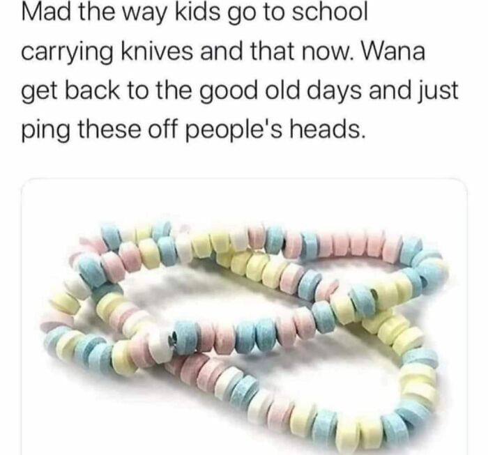 Colorful candy necklace on white background illustrating nostalgic posts capturing the magic of growing up in the ’90s.