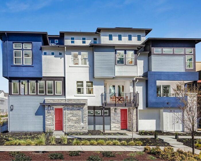 Modern home exterior with mismatched blue and gray color blocks highlighting failed creative home design ideas.
