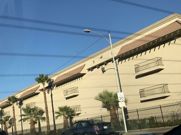 Building with non-functional balconies and awnings, an example of people trying to be creative with their homes and failed.