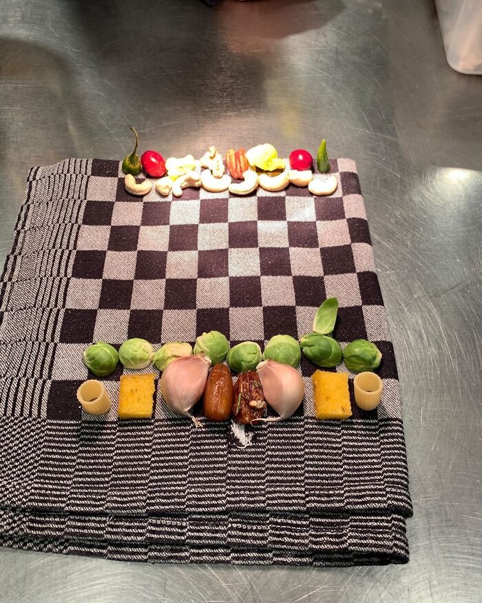 Assorted vegetables and nuts arranged on a checkered cloth, showcasing relatable chef humor and kitchen creativity.
