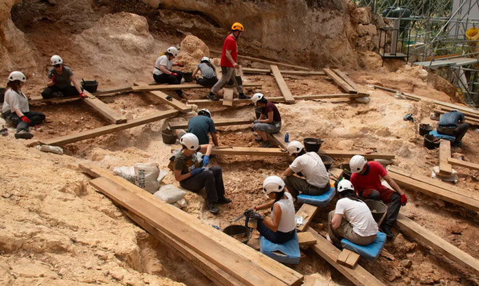 Archaeologists excavating a prehistoric site uncover gruesome evidence linked to ancient ancestors eating toddlers like prey.