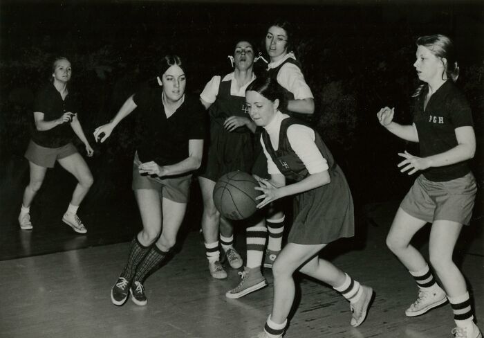 Vintage photo of nurses playing basketball, showcasing the spirit and style of nurses who brought healing and hope.