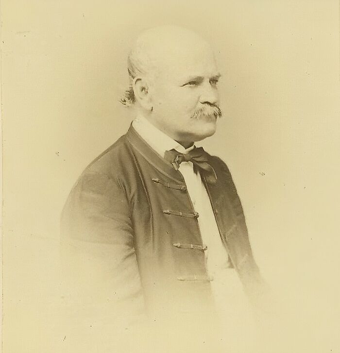 Sepia-toned portrait of a 19th-century celebrity with a mustache, wearing a formal jacket, representing misunderstood celebrities.