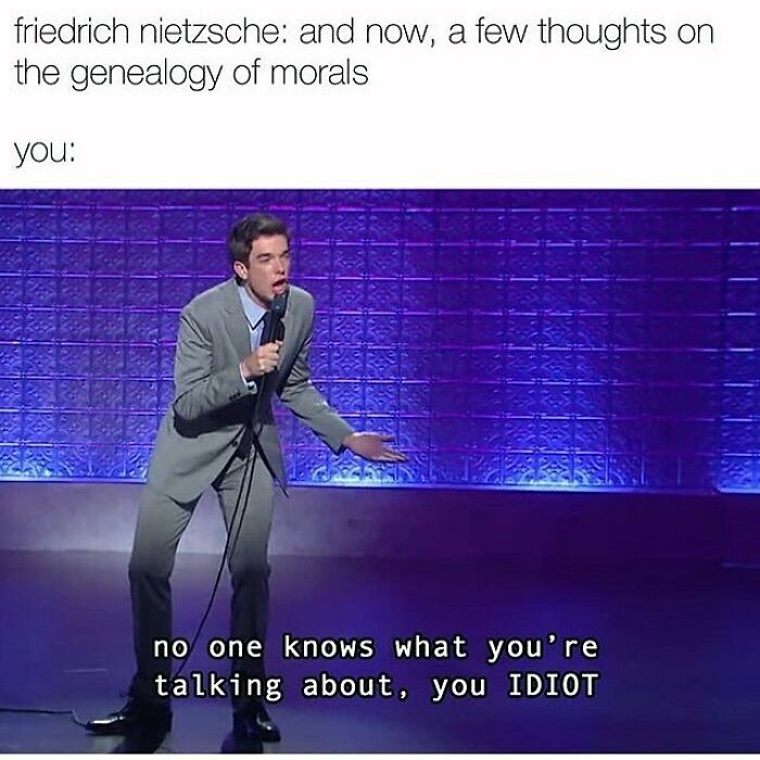 Comedian on stage reacting humorously to complex philosophical memes about genealogy of morals and Nietzsche's ideas.