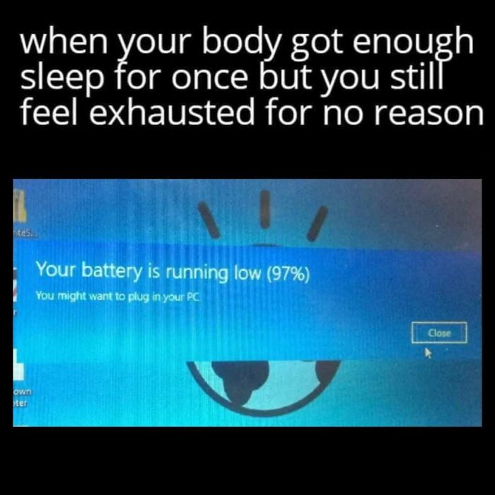 Meme showing exhaustion despite sleep with a computer low battery warning, reflecting casual nihilism humor.