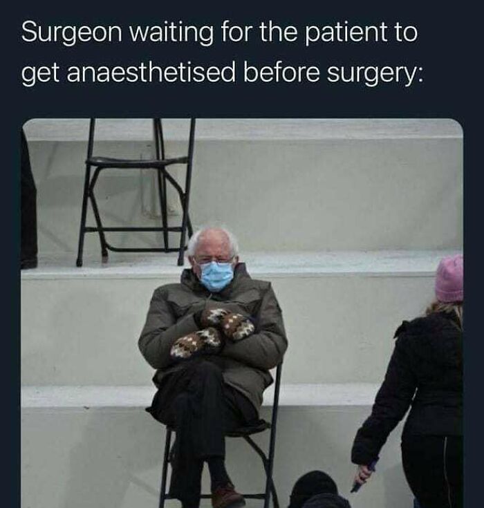 Man wearing a mask and mittens sitting on a chair, illustrating medical memes about healthcare and surgery wait times.