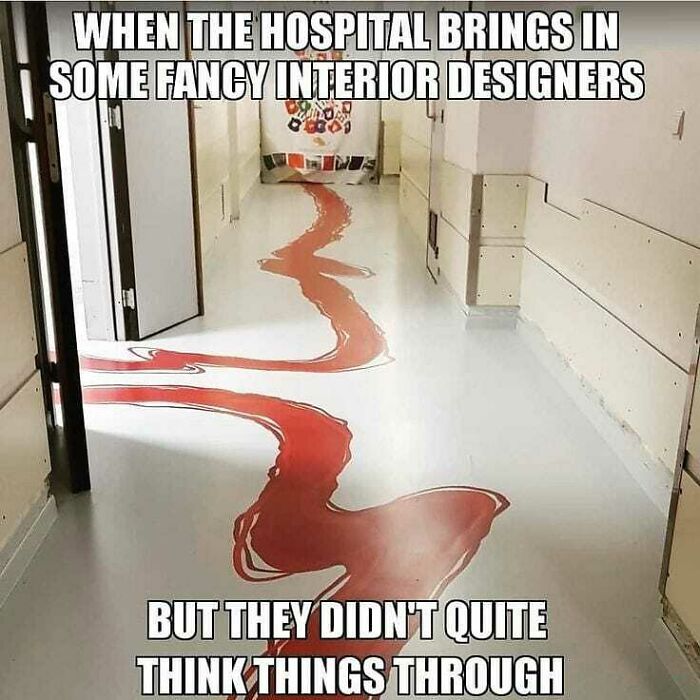 Hospital hallway floor painted with a red winding pattern, humorously referencing medical memes about healthcare costs.