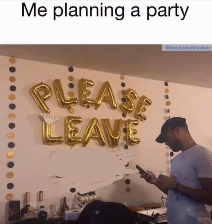Person standing at a party with gold balloons spelling please leave, highlighting social anxiety memes humor.
