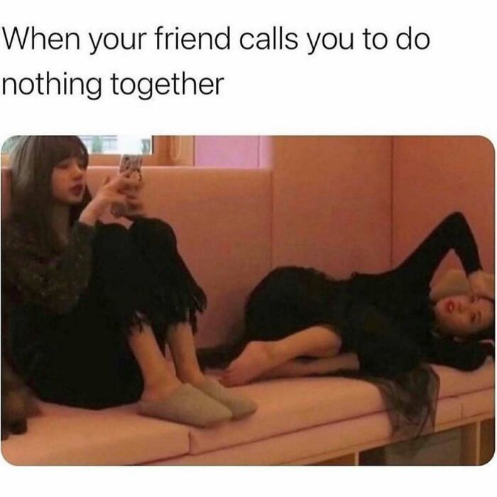 Two women relaxing on a couch, capturing a relatable friendship meme about doing nothing together with best friends.