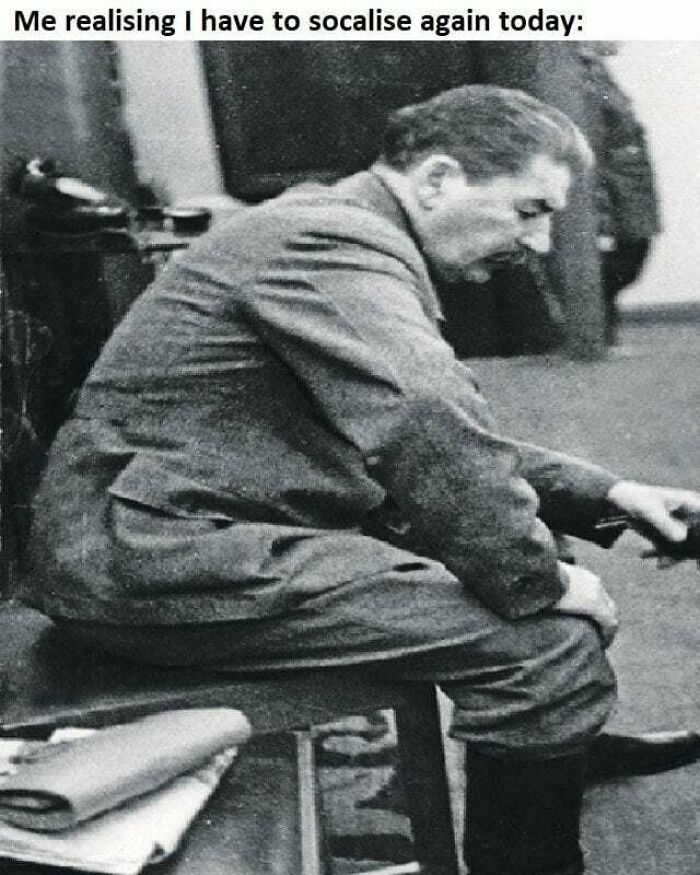 Man sitting on a bench looking stressed and tired, expressing feelings related to social anxiety memes.