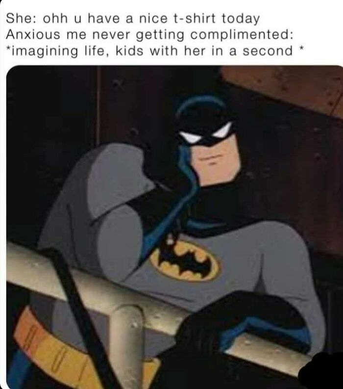 Batman leaning on railing with text about social anxiety imagining a future after a simple compliment in social anxiety memes.