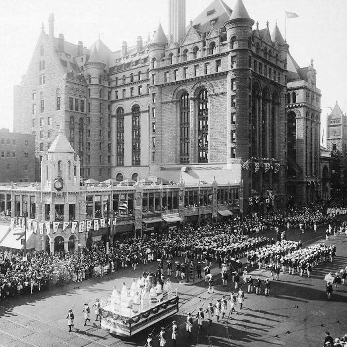 Historic parade in front of old architecture showcasing classic design and beautiful past urban style.