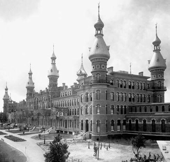 Historic old architecture building with ornate towers and detailed brickwork showcasing beautiful past design.