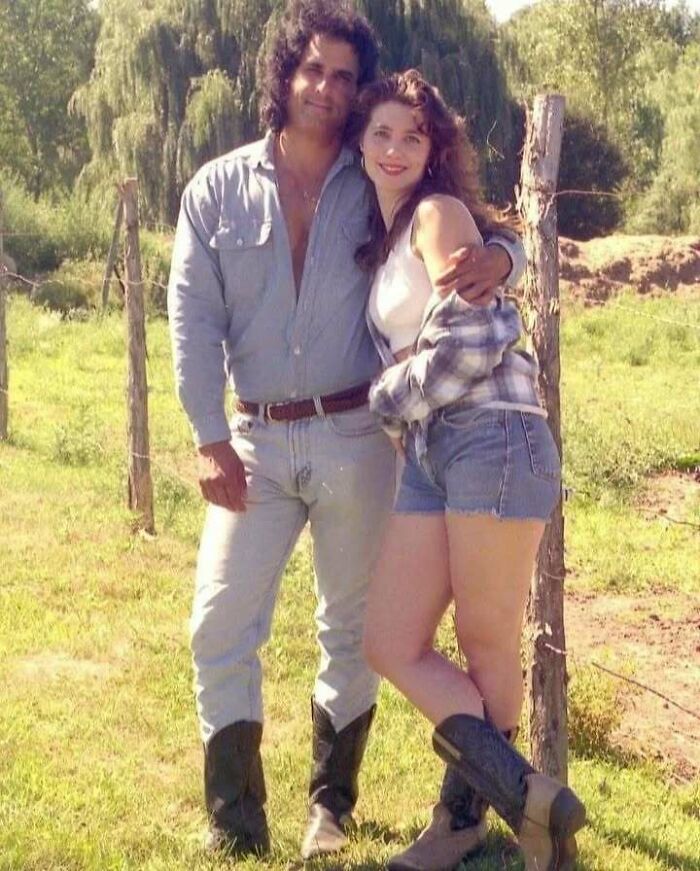 Man and woman posing outdoors wearing cowboy boots, showcasing old school cool style with denim and casual tops.