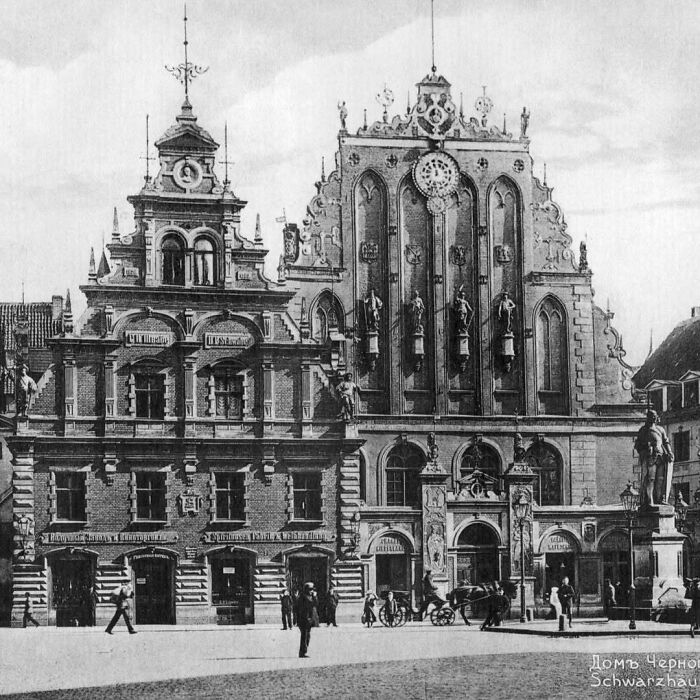 Old architecture showcasing intricate historic building facades and statues in a vintage city square scene.