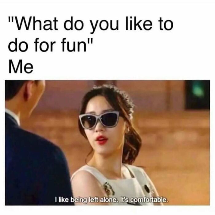Woman wearing sunglasses saying she likes being left alone, a funny meme reminding not to take life too seriously.