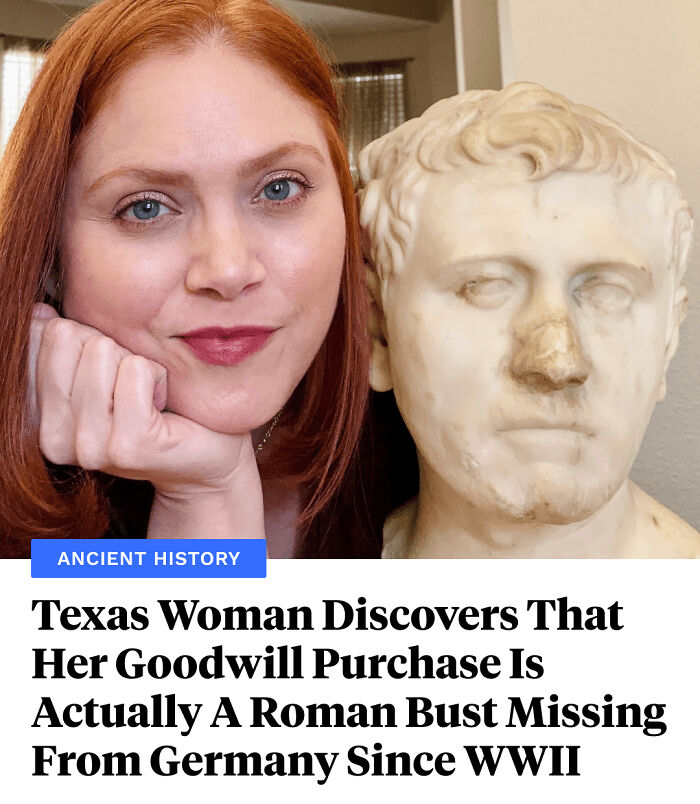 Woman with red hair posing next to a Roman bust, showcasing an interesting facts discovery from ancient history.