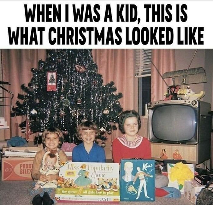 Three kids sit by a Christmas tree in the 80s with vintage toys and an old TV, evoking good old days nostalgia.