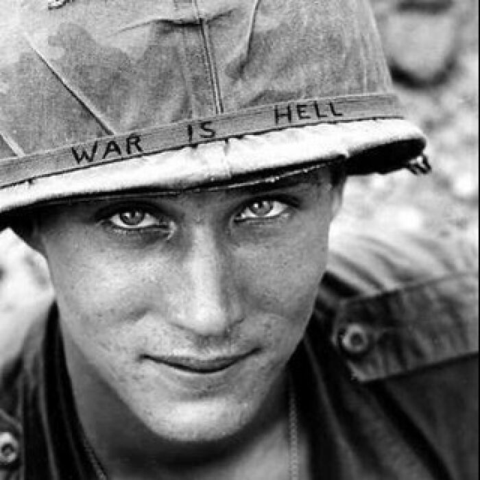 Black and white photo of a soldier wearing a helmet with the phrase war is hell, illustrating interesting facts.