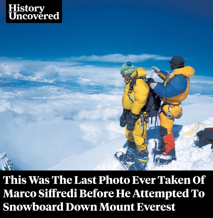 Two climbers in bright yellow gear preparing for a high-altitude expedition with surprising facts about Mount Everest.