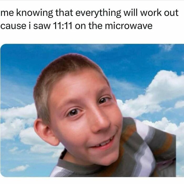 Young boy smiling confidently with sky background, representing funny memes reminding not to take life too seriously.