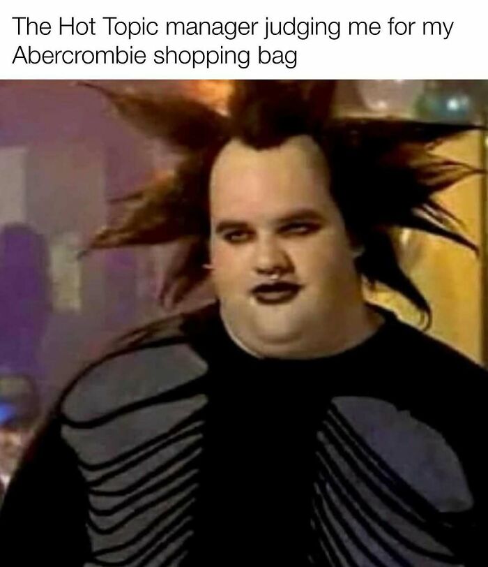 Person with spiked hair and dark makeup expressing judgment, referencing nostalgia memes about Tamagotchis and VHS tapes.