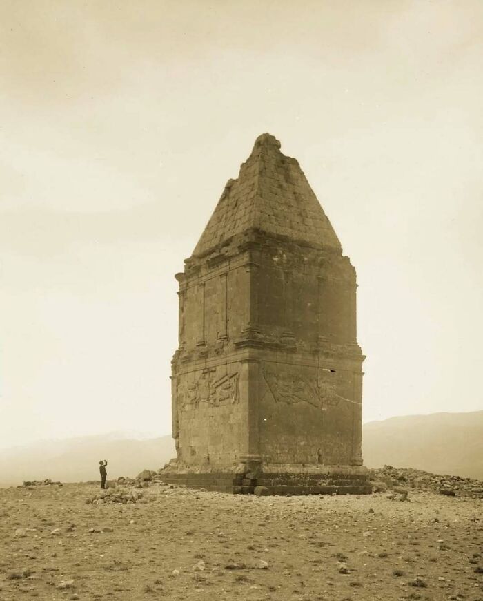 Ancient stone monument in a barren landscape showcasing old architecture and historic design features.