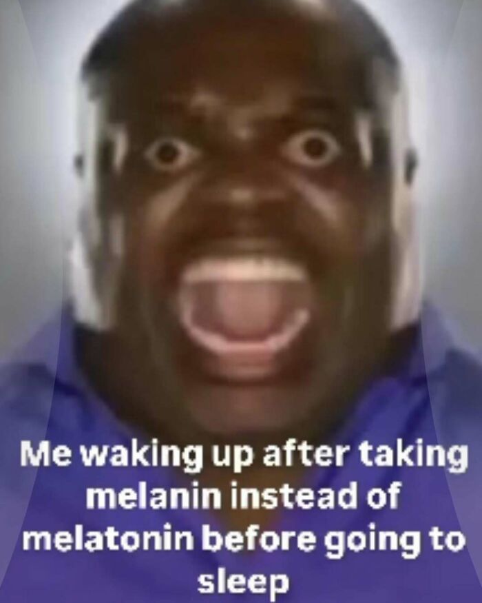 Close-up of a surprised man with wide eyes and open mouth in a nerdy and very weird meme about waking up confused.