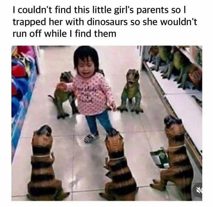 Little girl surrounded by toy dinosaurs in store aisle creating a random and chaotic meme moment.