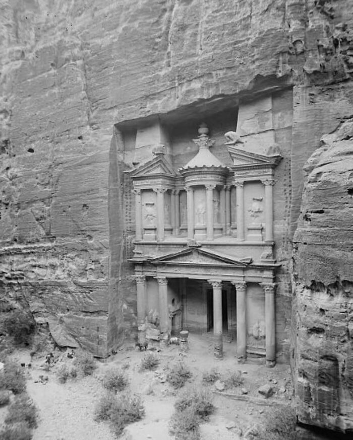 Ancient rock-cut old architecture with columns and intricate carvings showcasing the beauty of past construction.