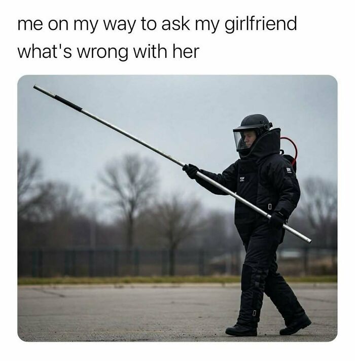 Person in b**b disposal suit holding a long pole, representing chaotic memes with unexpected humor.