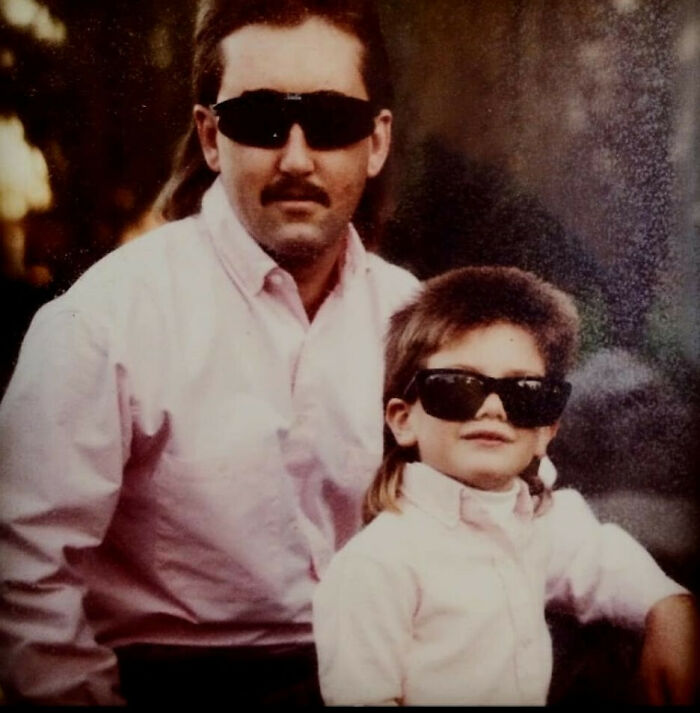 Father and son from the past wearing sunglasses and vintage outfits, capturing old school cool style and attitude.