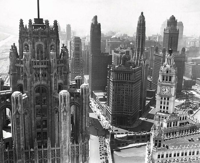 Black and white photo of old architecture showcasing historic skyscrapers and detailed gothic and classical building designs.