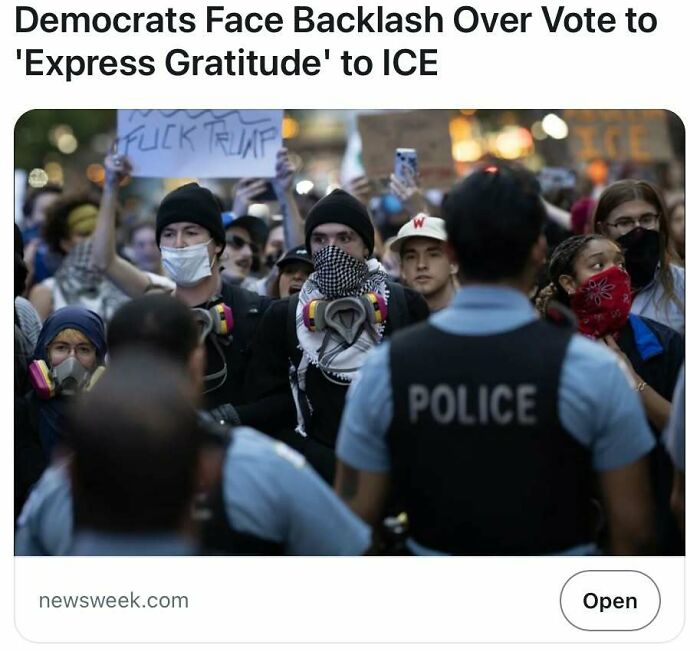 Protesters wearing masks and bandanas face police officers during a controversial political backlash event.