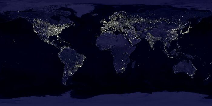Satellite view of the internet at night showing global connectivity and regions with high network activity and light intensity. - 24