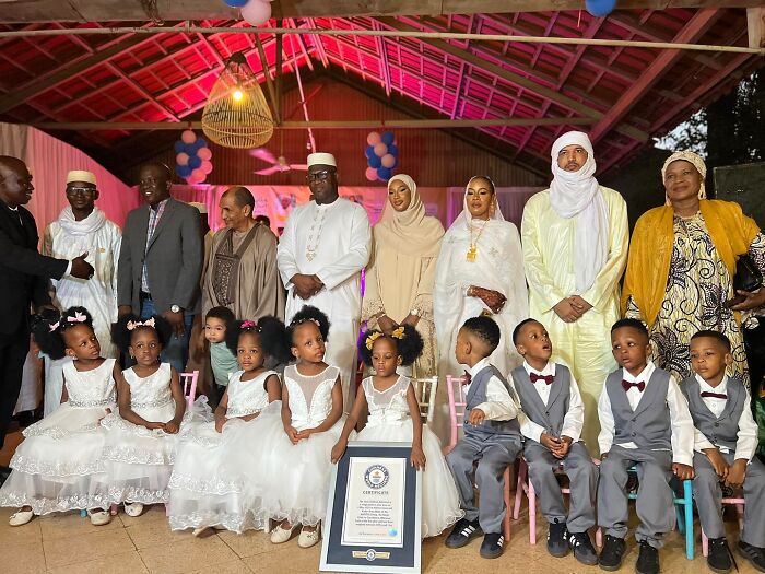 The world&rsquo;s first surviving nonuplets dressed for their 4th birthday celebration with family and a certificate displayed.