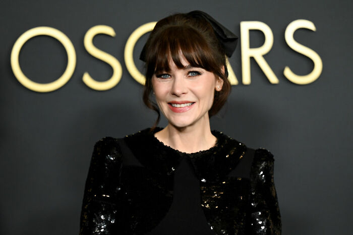 Female celebrity in a black sequin outfit at an Oscars event, representing celebrities that choose not to overspend.