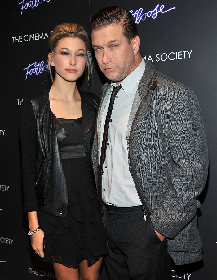 Hailey Bieber and her dad Stephen Baldwin posing at a film event amid family rift and $1B Rhode sale news.