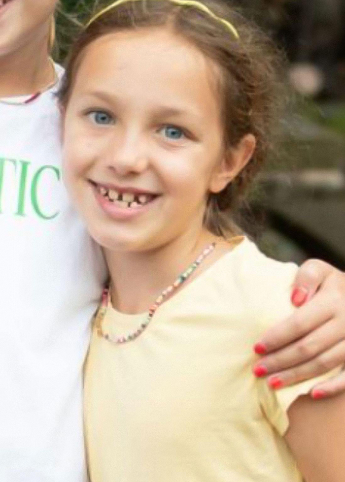 Young girl with blue eyes smiling, family of Travis Kelce's boss mourns loss in Texas floods with heartfelt statement