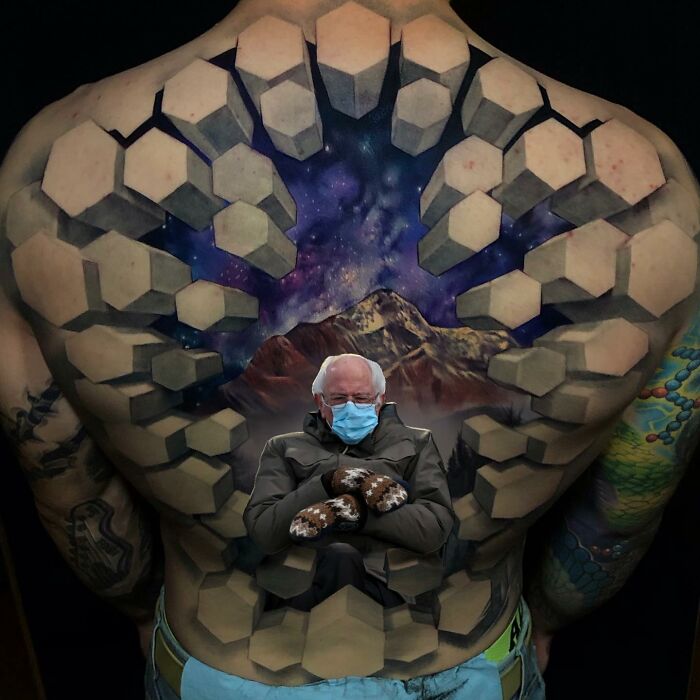 3D tattoo on a back by Jesse Rix featuring a geometric portal to another world with mountains and a starry sky.