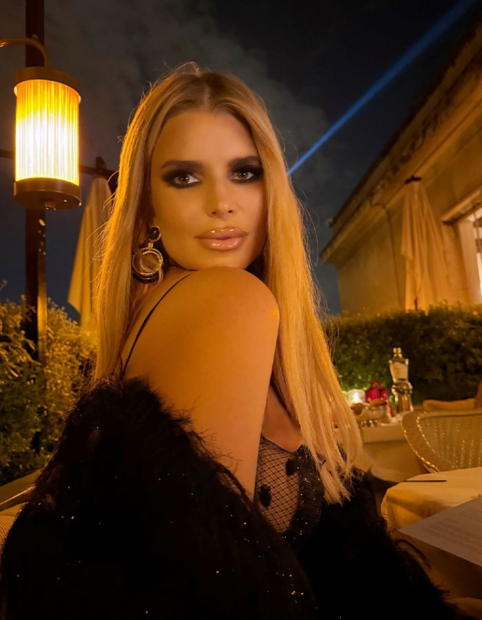 Jessica Simpson posing outdoors at night, showcasing a stylish look after significant Ozempic weight loss.