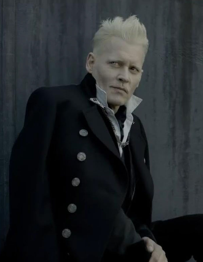 Johnny Depp in dark gothic attire with platinum blond hair, reflecting on his dark childhood with violent mom.
