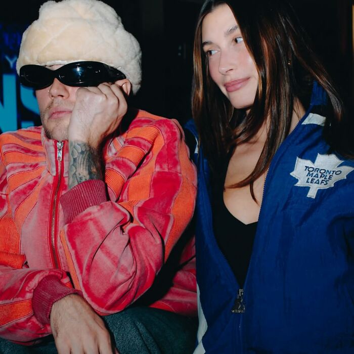 Justin Bieber wearing sunglasses and a cozy hat, reflecting on marriage and mental struggles in new album SWAG.