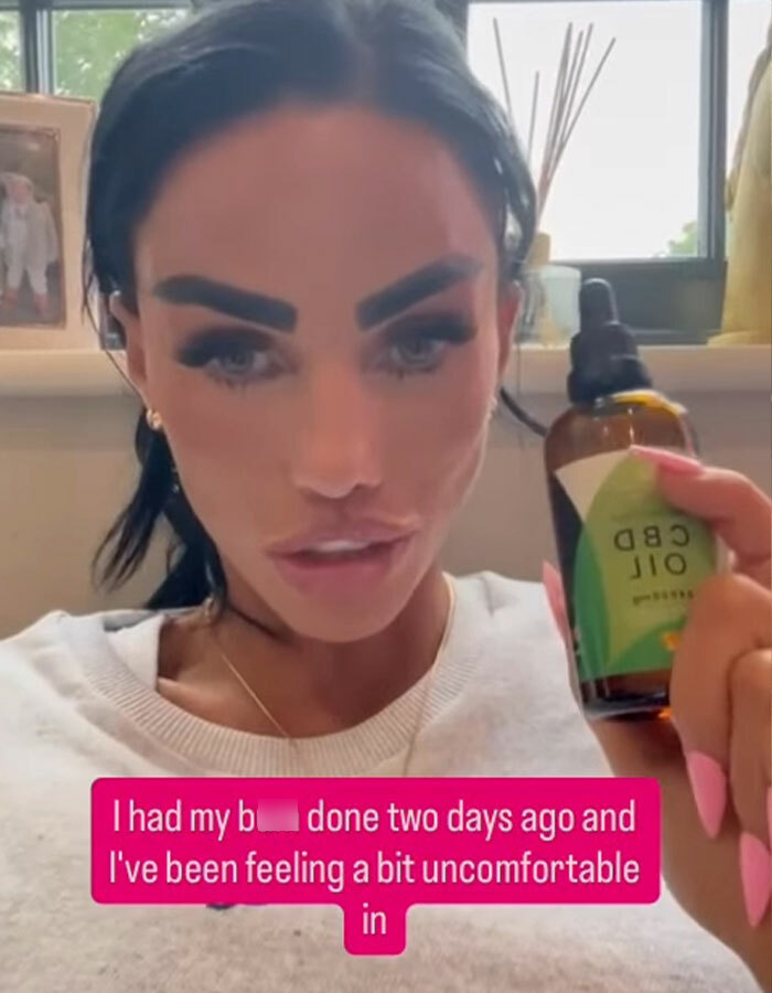 Katie Price holding a bottle of CBD oil, discussing painful bum filler side effects after treatment. - 4