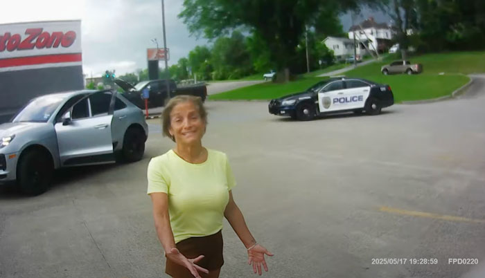 Olympic gold medalist Mary Lou Retton outside near police car during sobriety test arrest video footage.