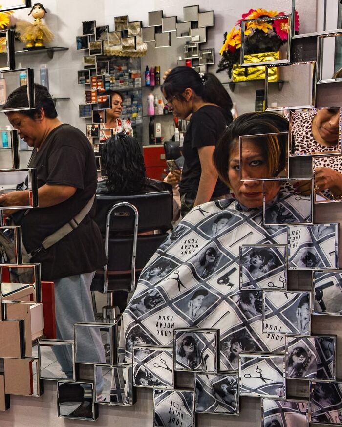 Busy hair salon scene reflecting honest street moments captured by a photographer showing the beauty of everyday life.
