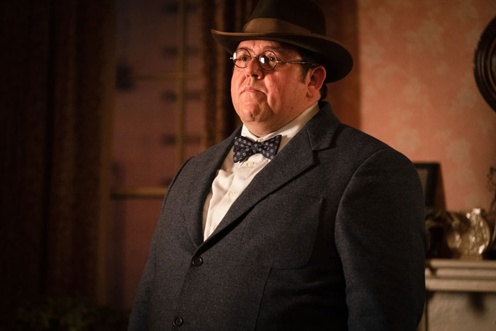 Man dressed in vintage suit and hat portraying Hagrid, a character discussed by Harry Potter fans in the upcoming series.