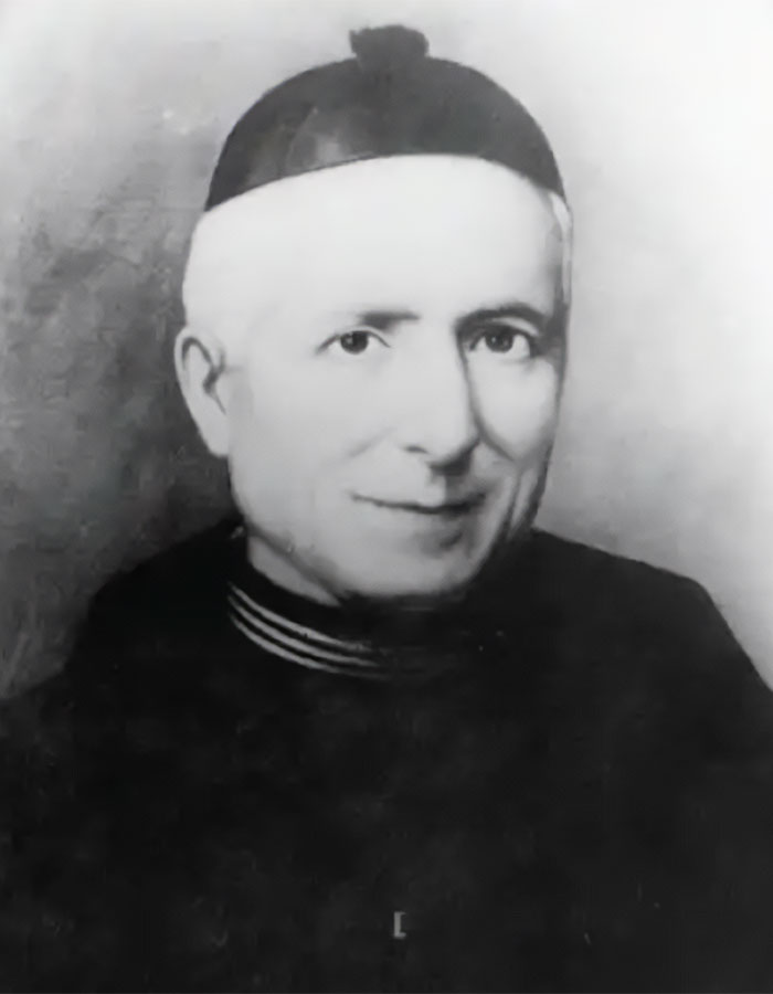 Black and white photo of a doctor involved in Pope Leo’s miracle wearing a religious cap and dark clerical clothing. - 6