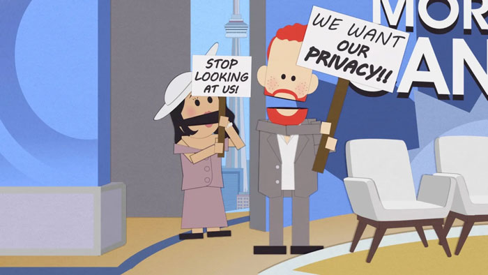 Animated characters holding protest signs in a Family Guy scene trolling Meghan Markle and Prince Harry privacy issues.
