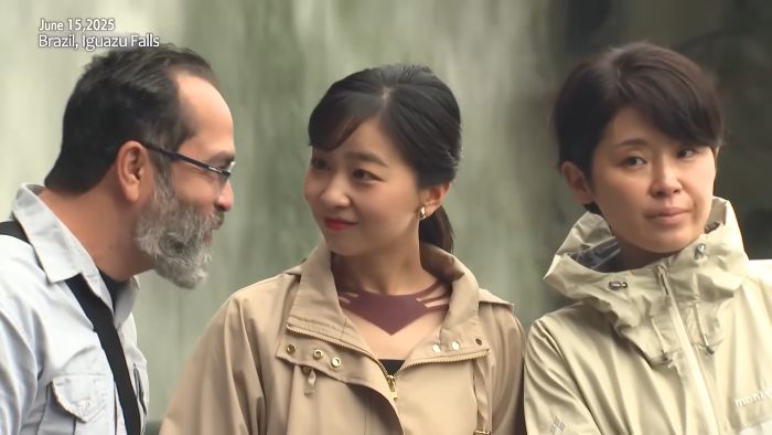 Japanese Princess Kako smiling and talking with two people outdoors near Iguazu Falls in Brazil on June 15, 2025.